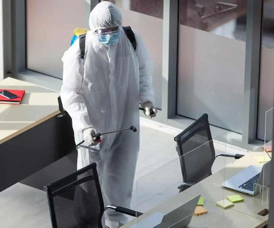 A person is disinfecting office in dubai