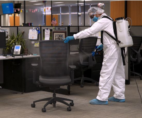 A person is disinfecting commercial building in Dubai
